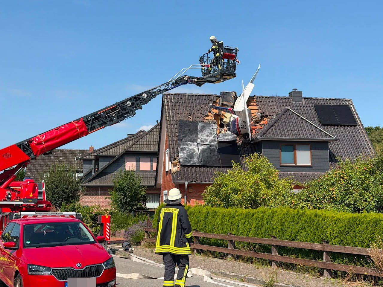 Two dead after plane crashes onto German house roof